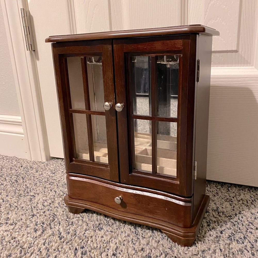 Dark brown wood jewelry organizer with window drawers and drawer